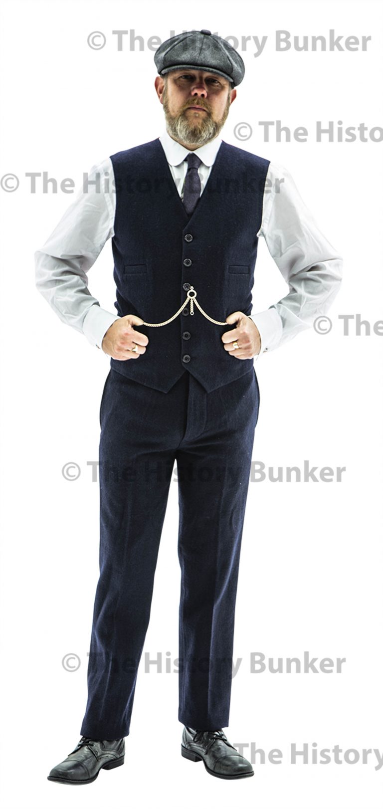 An Edwardian-era suit jacket with a prominent third button, showcasing the era's love for ornate tailoring.